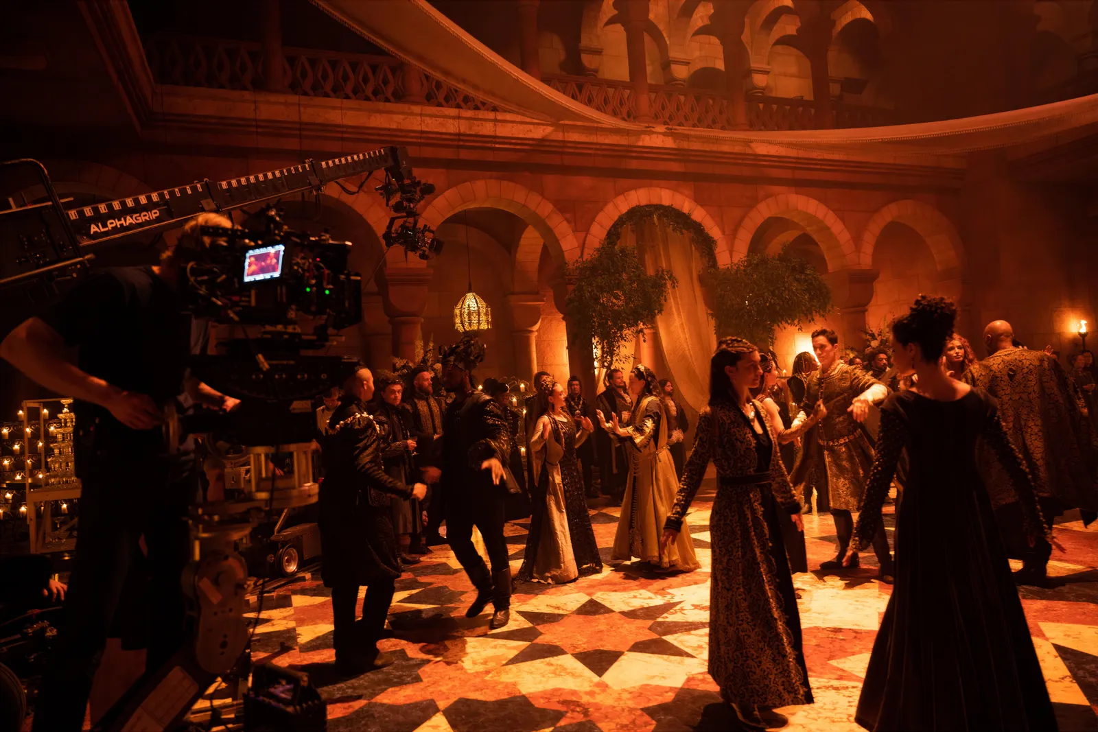 Period dancers on a tiled ballroom floor on The Witcher season 3