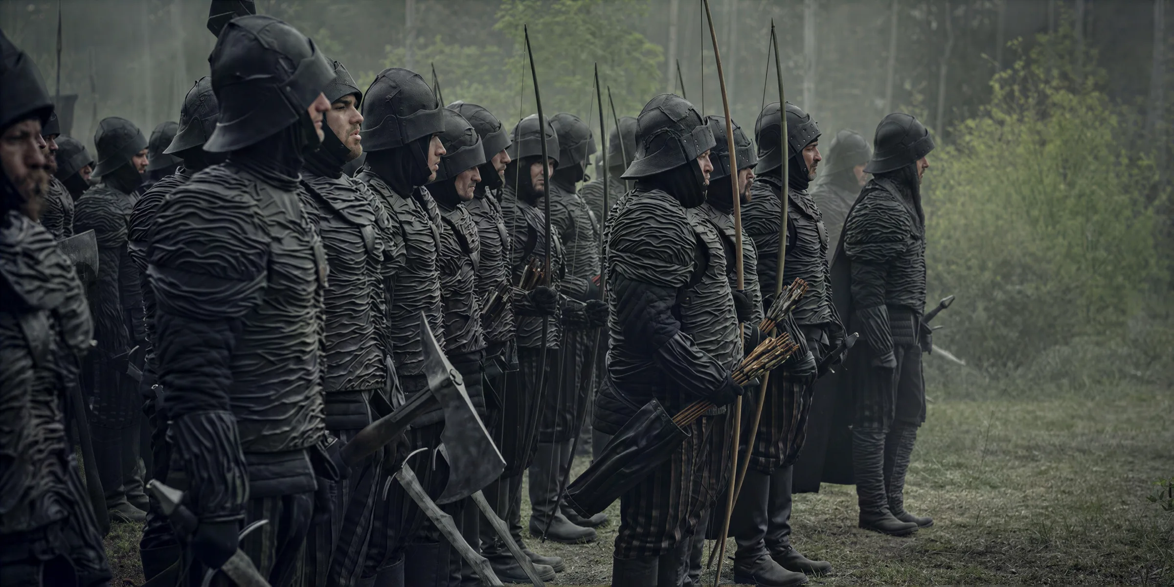 A line of archers drawing their bows, in The Witcher